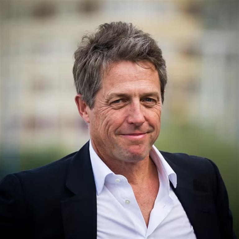 Hugh Grant calls for ban on laptops, tablets in school