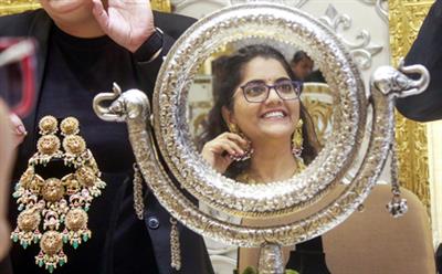 Gold prices slip after US Fed signals more gradual path for rate cuts