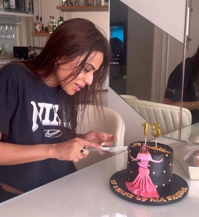 Nia Sharma celebrates with a cake as she completes 15 years in the television industry